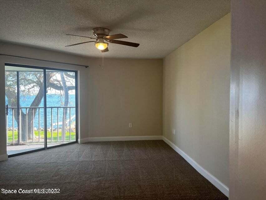 100 Canebreakers Drive, Unit 206 Cocoa, FL 32927 - Photo 12 of 36 a view of an empty room with a window
