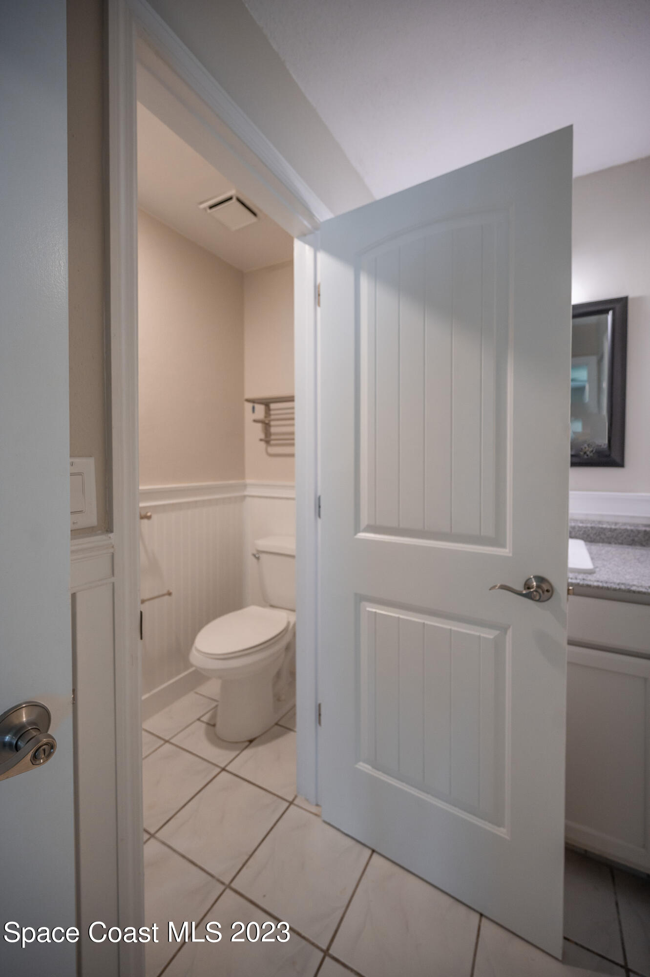 100 Canebreakers Drive, Unit 206 Cocoa, FL 32927 - Photo 16 of 36 a bathroom with a toilet and a shower