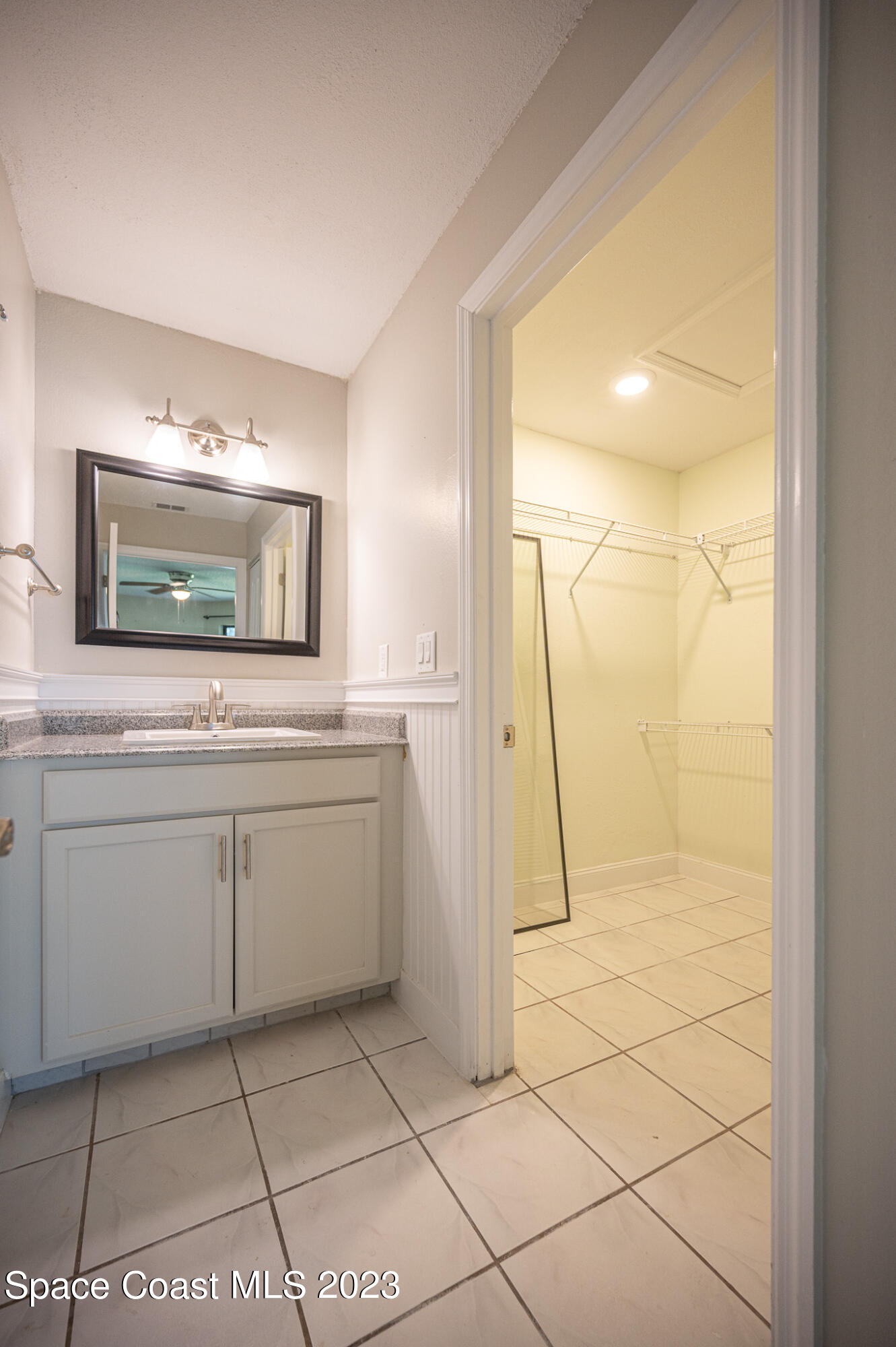 100 Canebreakers Drive, Unit 206 Cocoa, FL 32927 - Photo 18 of 36 a bathroom with a shower a sink and a mirror