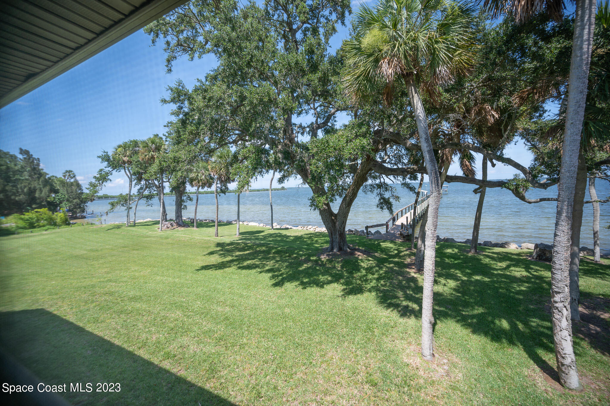 100 Canebreakers Drive, Unit 206 Cocoa, FL 32927 - Photo 2 of 36 a view of backyard with green space