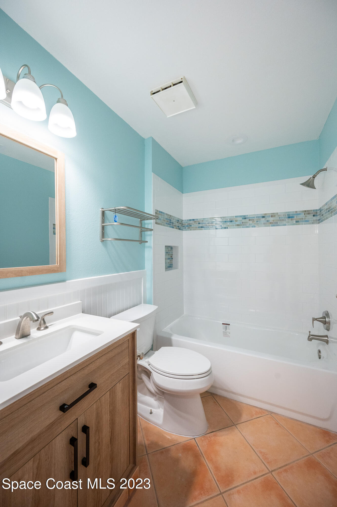 100 Canebreakers Drive, Unit 206 Cocoa, FL 32927 - Photo 23 of 36 a bathroom with a sink a toilet and a mirror