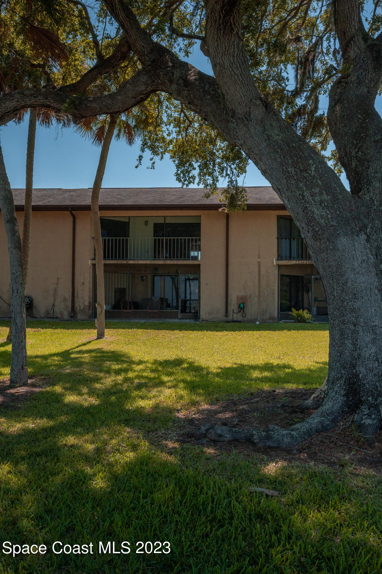 100 Canebreakers Drive, Unit 206 Cocoa, FL 32927 - Photo 25 of 36 a view of a house with a yard