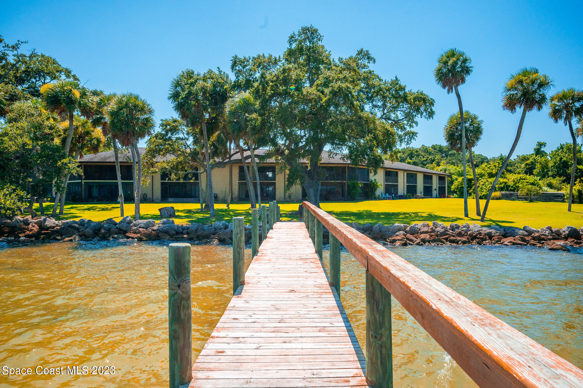 100 Canebreakers Drive, Unit 206 Cocoa, FL 32927 - Photo 26 of 36 swimming pool view with a lake view