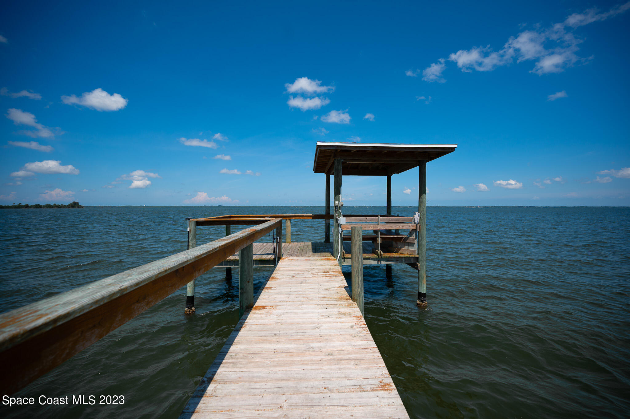 100 Canebreakers Drive, Unit 206 Cocoa, FL 32927 - Photo 30 of 36 a swimming pool view with a lake view