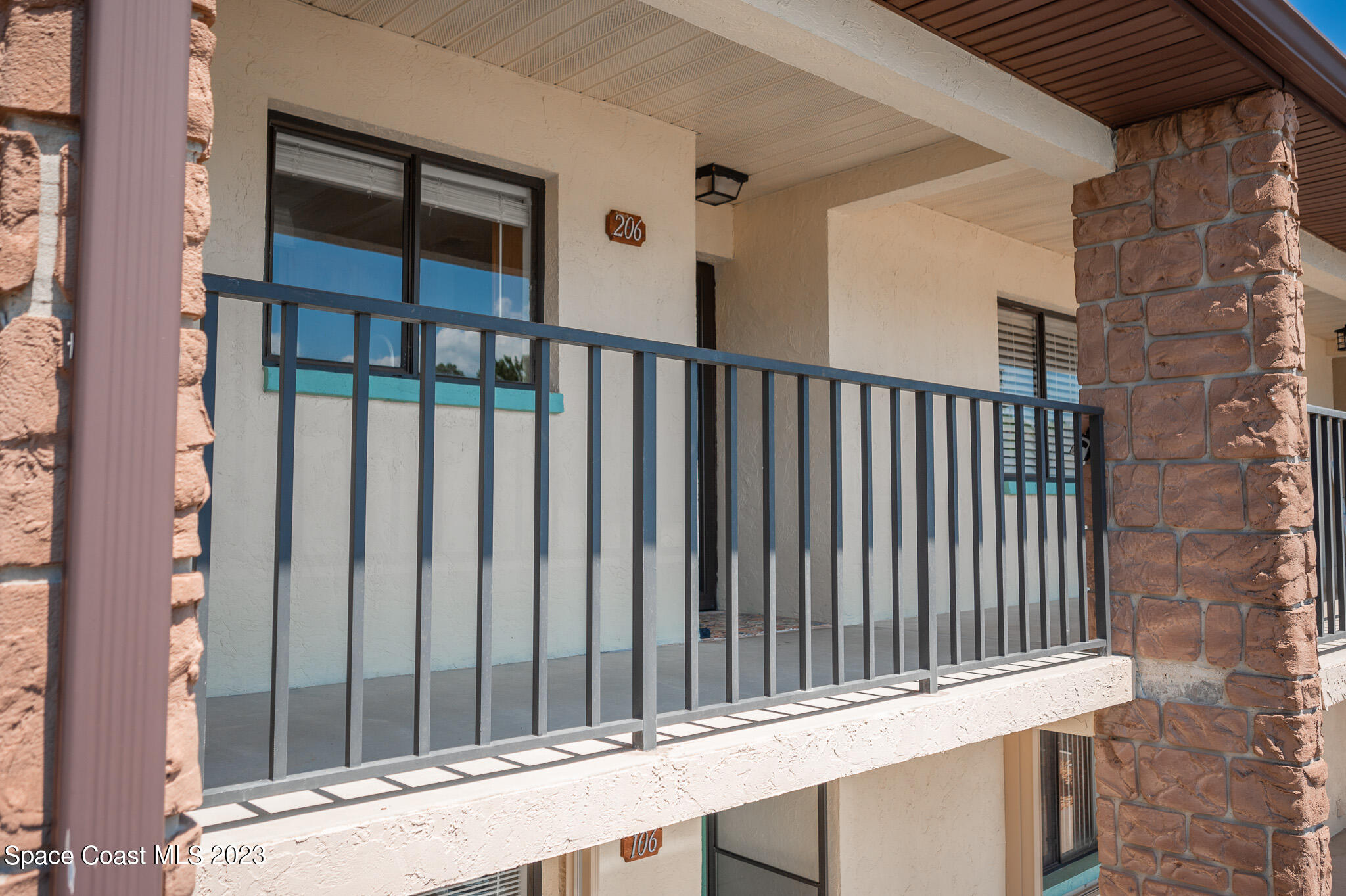 100 Canebreakers Drive, Unit 206 Cocoa, FL 32927 - Photo 3 of 36 a view of wooden balcony