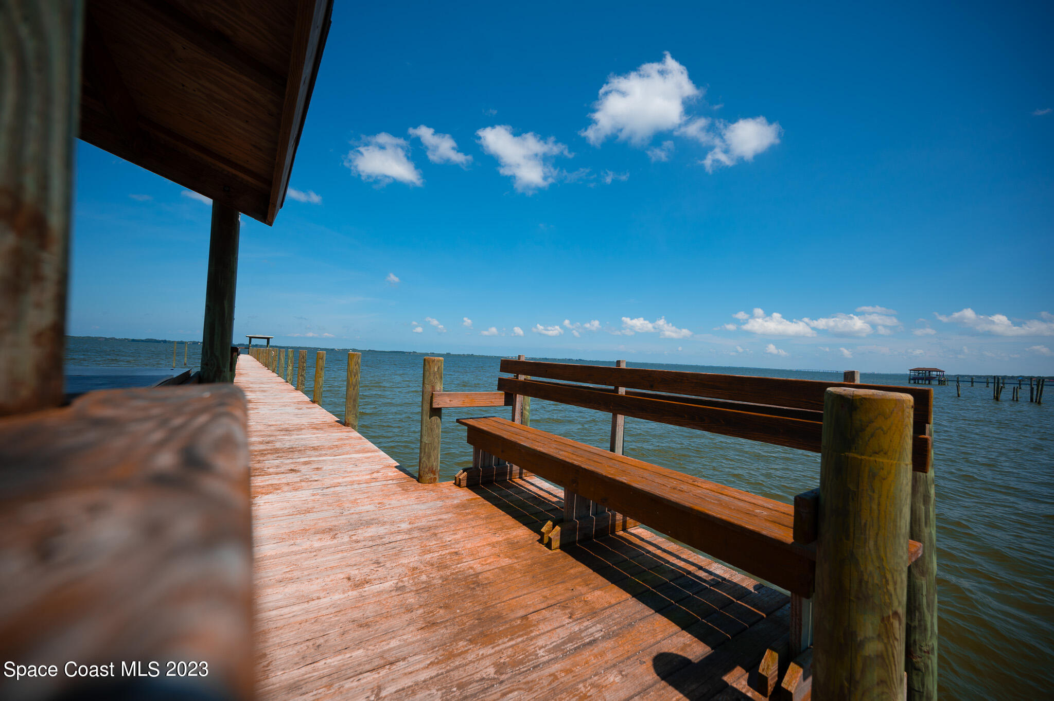 100 Canebreakers Drive, Unit 206 Cocoa, FL 32927 - Photo 32 of 36 a view of kitchen and hall with a chair