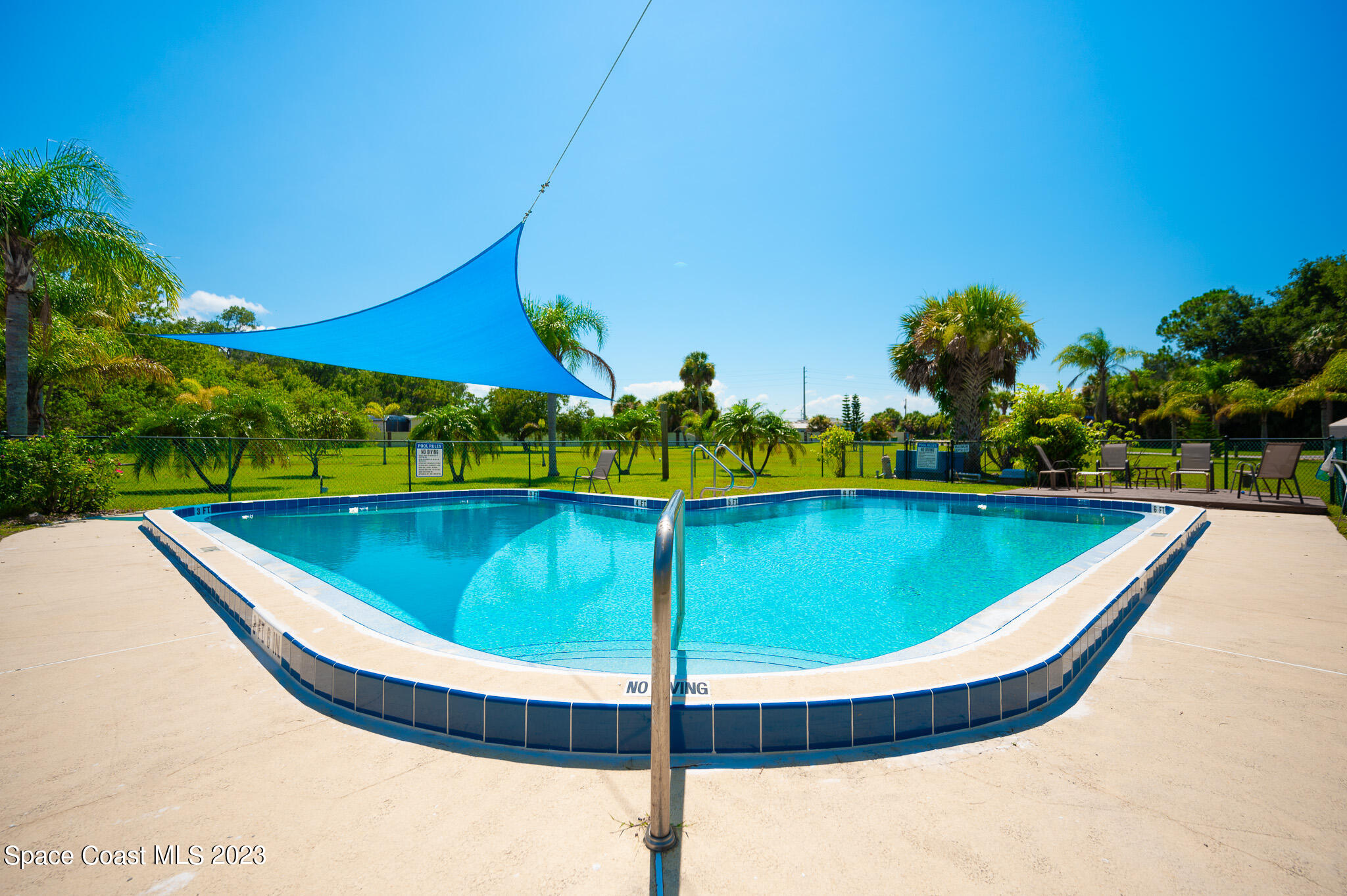100 Canebreakers Drive, Unit 206 Cocoa, FL 32927 - Photo 36 of 36 a view of a pool in a backyard