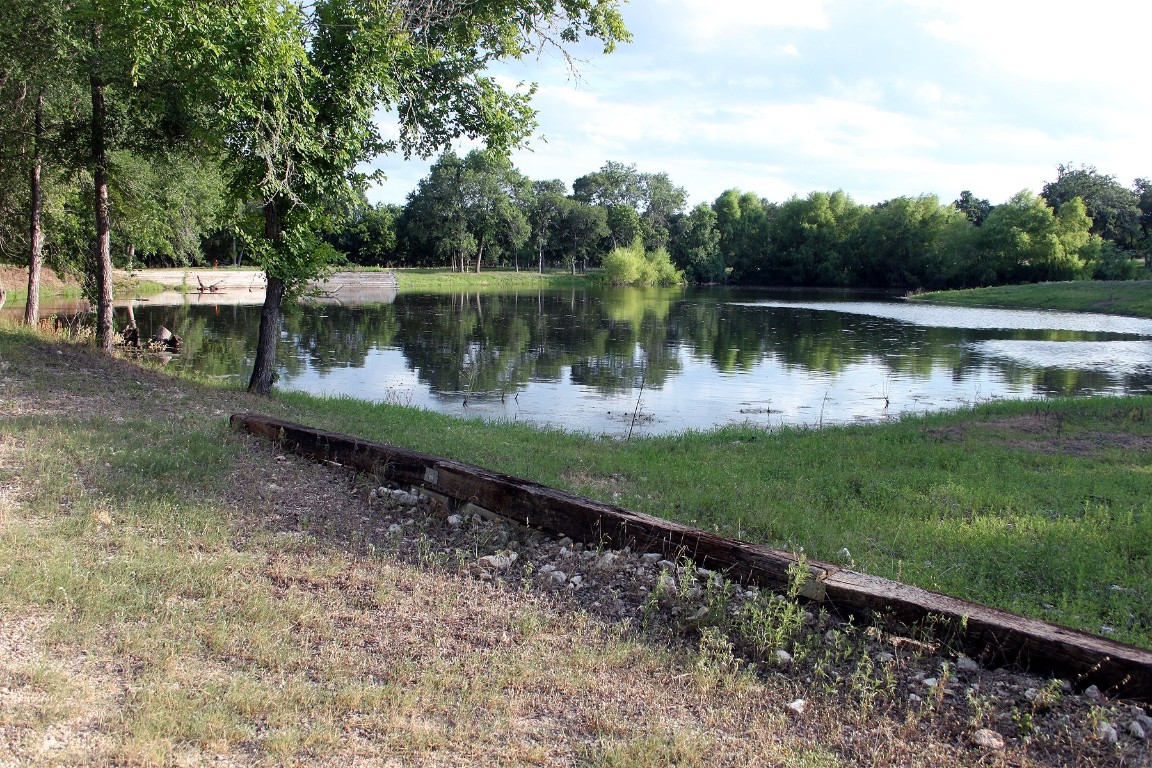 900 Old Lytton Springs Road Lockhart, TX 78644 - Photo 17 of 34 a view of a lake with a house in the background