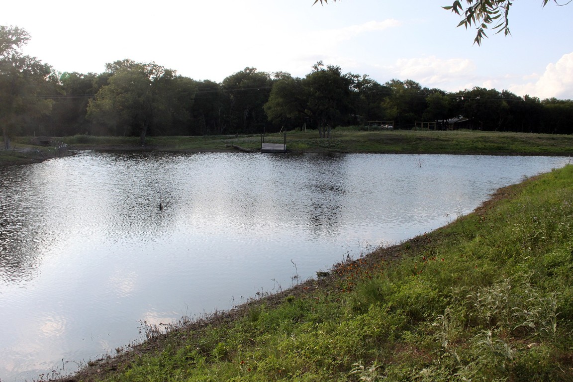 900 Old Lytton Springs Road Lockhart, TX 78644 - Photo 22 of 34 a view of a lake with a yard