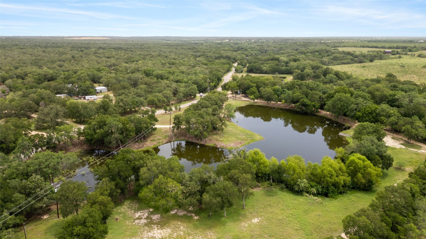 900 Old Lytton Springs Road Lockhart, TX 78644 - Photo 33 of 34 an aerial view of residential houses with outdoor space and trees