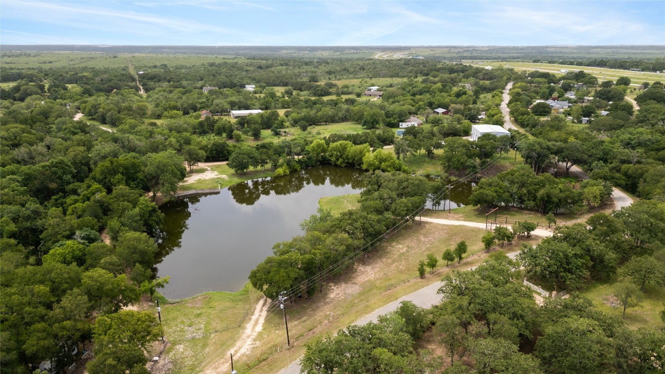 900 Old Lytton Springs Road Lockhart, TX 78644 - Photo 4 of 34 an aerial view of residential houses with outdoor space and trees