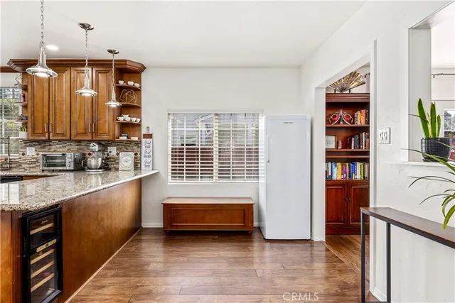 a bathroom with a double vanity sink a mirror and a bathtub
