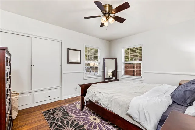 a bedroom with a large bed and a window
