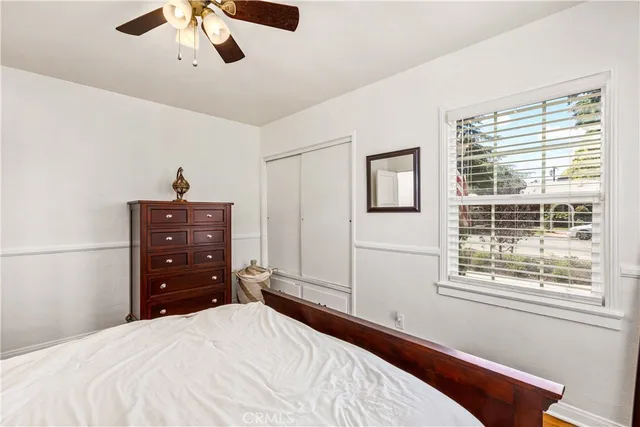 a bedroom with a bed and a closet