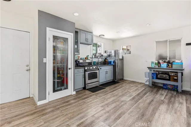 a kitchen with stainless steel appliances granite countertop a stove and a refrigerator
