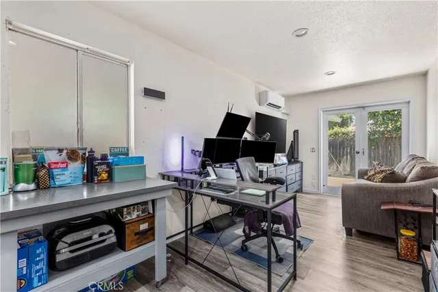 a work room with furniture and wooden floor