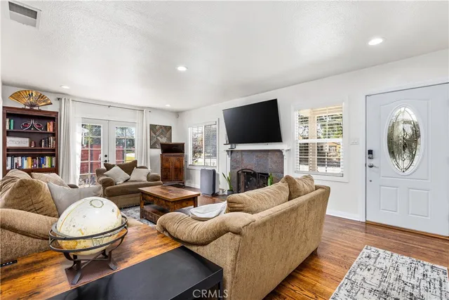 a living room with furniture fireplace and a flat screen tv