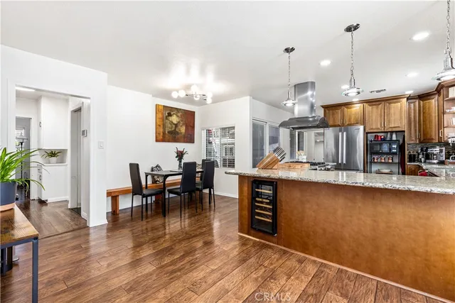 a large kitchen with a table and chairs
