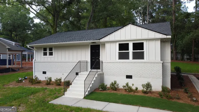 a front view of a house with garden