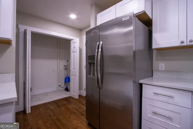 a view of hallway with wooden floor