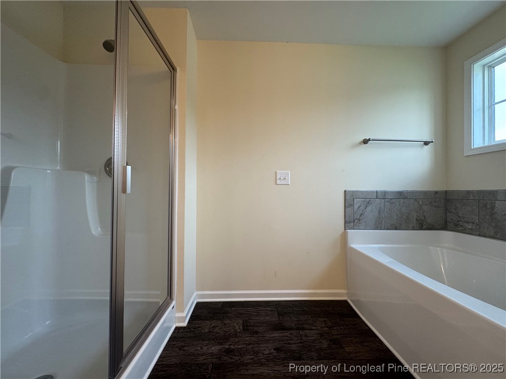 185 Ledgebrook Lane Raeford, NC 28376 - Photo 28 of 32 a bathroom with a bathtub