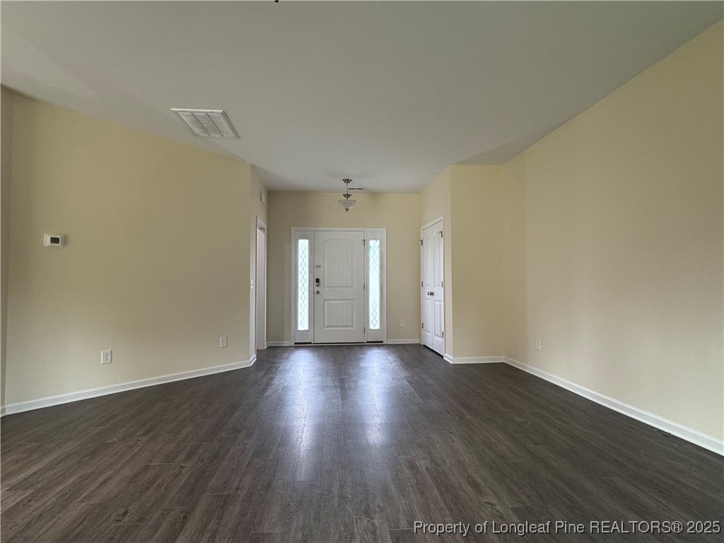 185 Ledgebrook Lane Raeford, NC 28376 - Photo 3 of 32 a view of an empty room and wooden floor