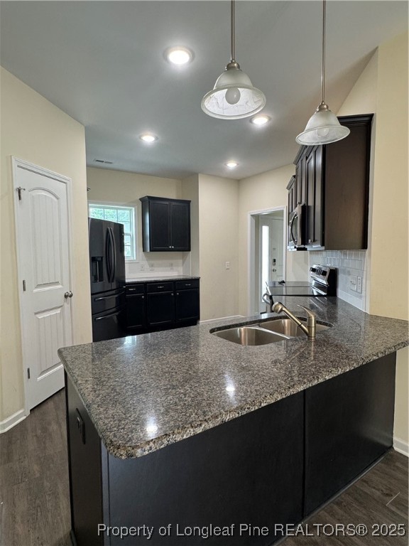 185 Ledgebrook Lane Raeford, NC 28376 - Photo 10 of 32 a kitchen with kitchen island granite countertop a sink a counter top space appliances and cabinets