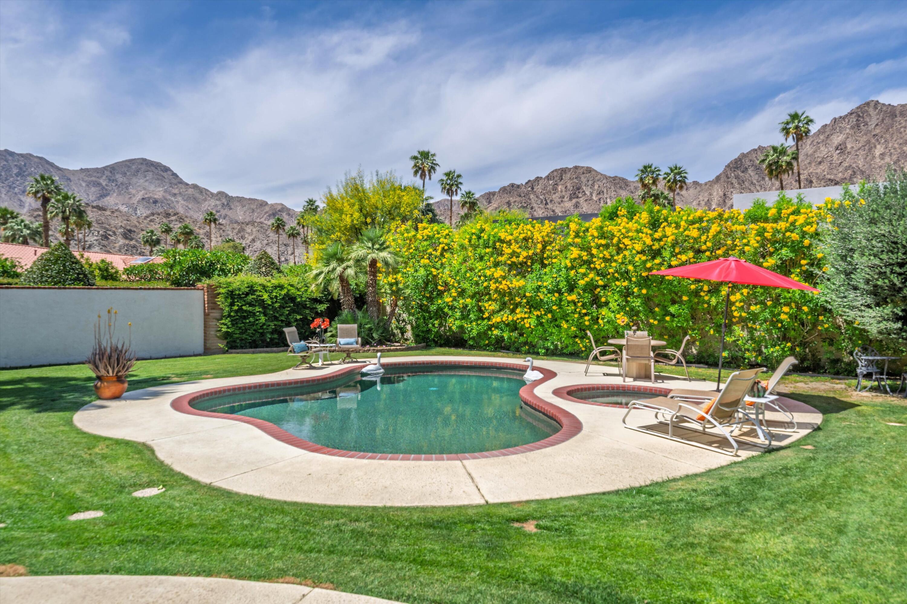 48800 Ave Anselmo La Quinta, CA 92253 - Photo 1 of 44 a view of a backyard with a patio and plants
