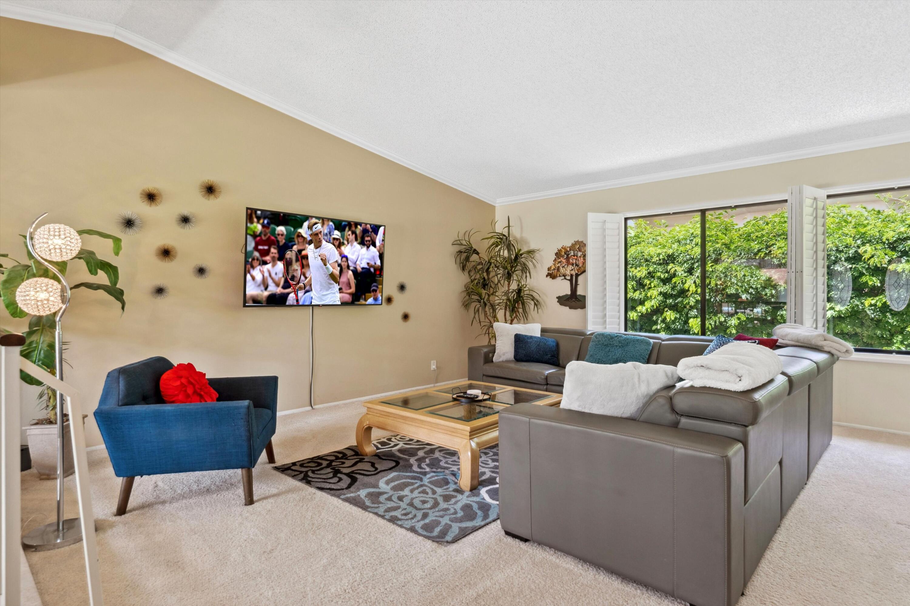 48800 Ave Anselmo La Quinta, CA 92253 - Photo 15 of 44 a living room with furniture and a large window