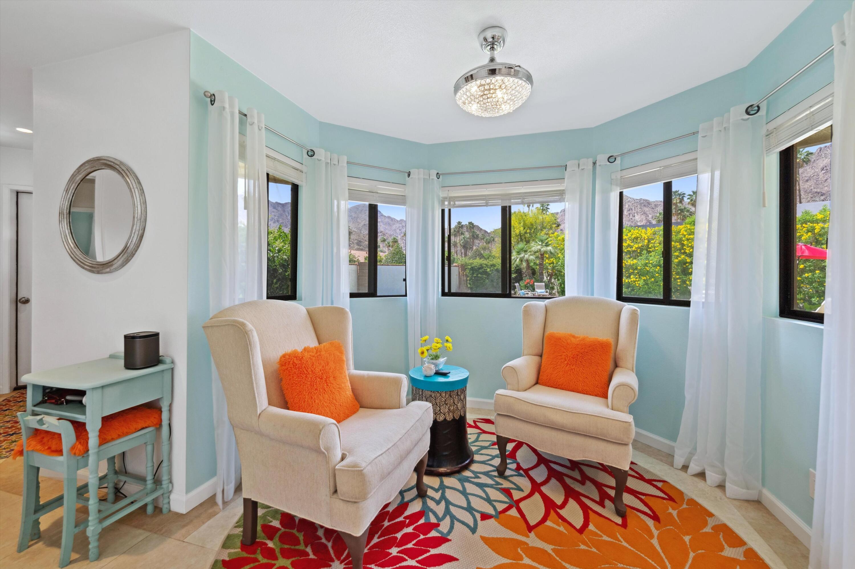 48800 Ave Anselmo La Quinta, CA 92253 - Photo 29 of 44 a living room with furniture a flat screen tv and a window
