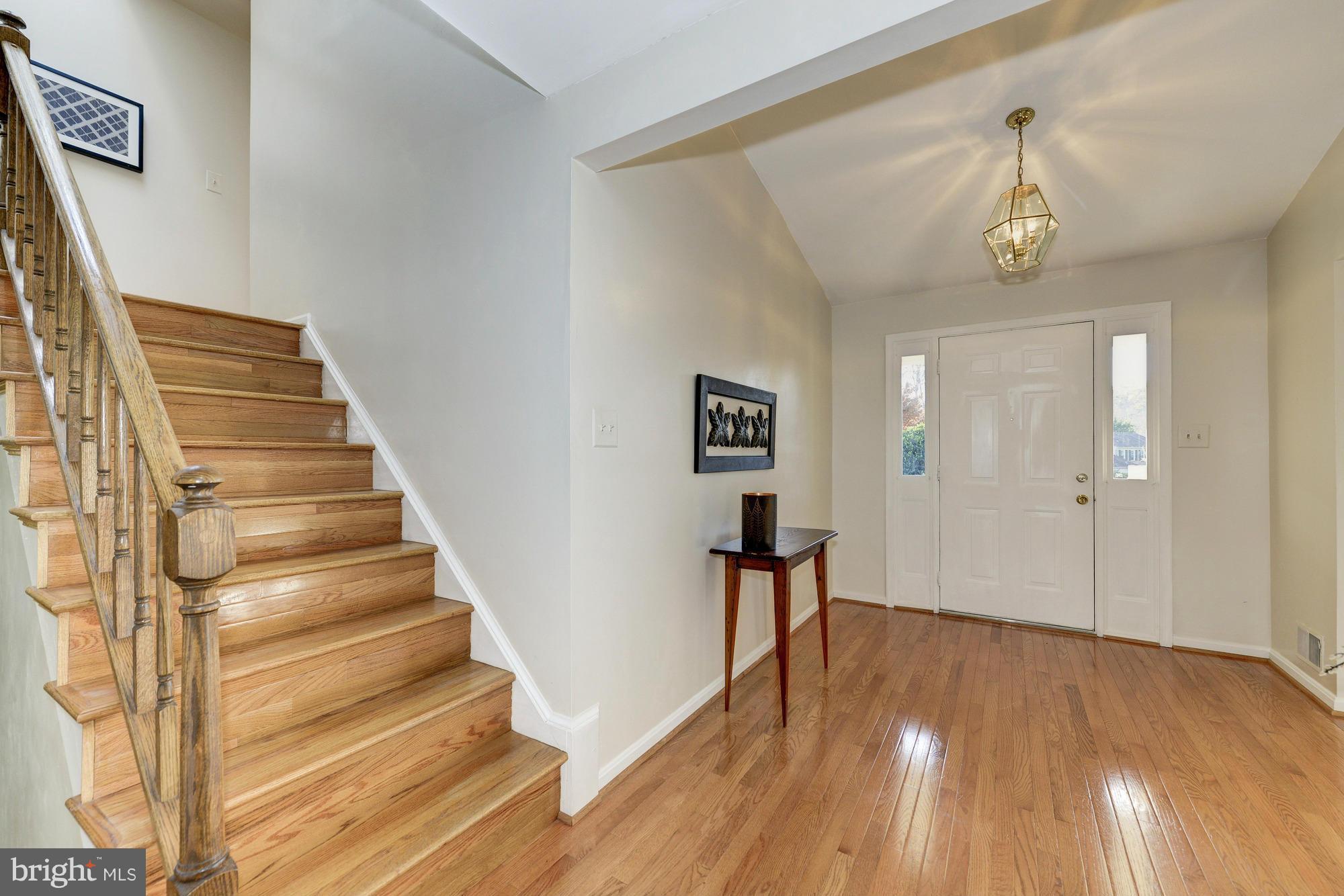 8700 Shadowlake Way Springfield, VA 22153 - Photo 14 of 30 Wood Stairs Leading to Upstairs and Family Room