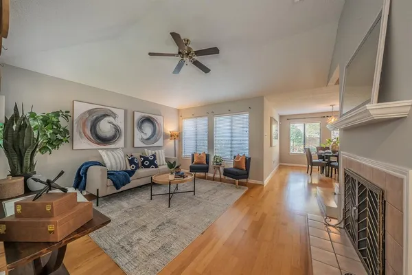 a living room with furniture and a fireplace