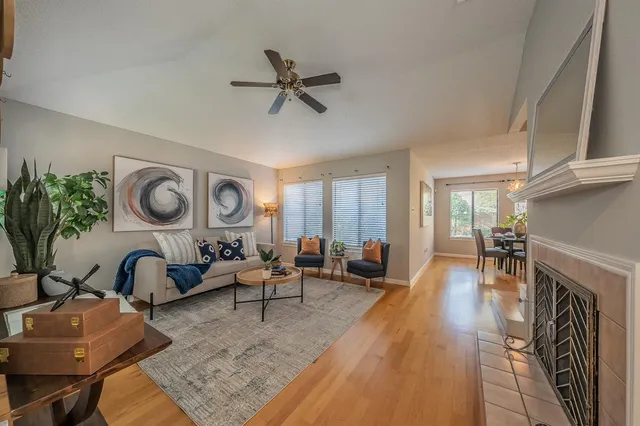 a living room with furniture and a fireplace