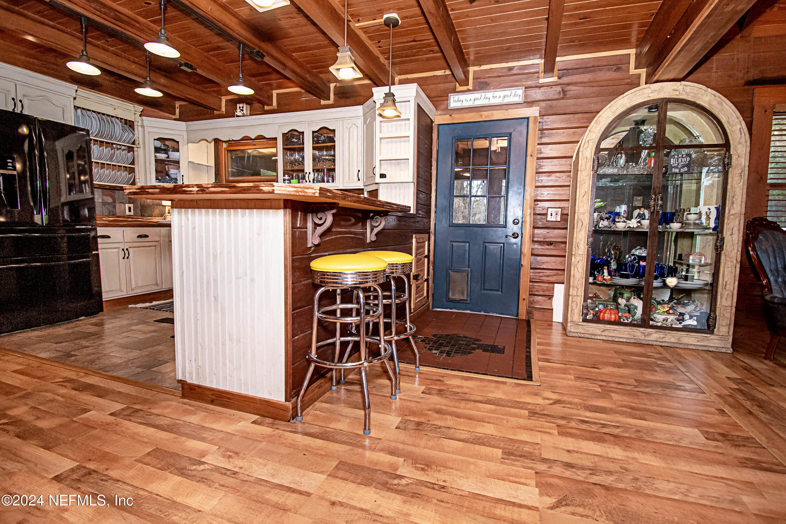149 Rhoden Drive Macclenny, FL 32063 - Photo 13 of 63 a view of a kitchen with stainless steel appliances kitchen island granite countertop a table and chairs in it