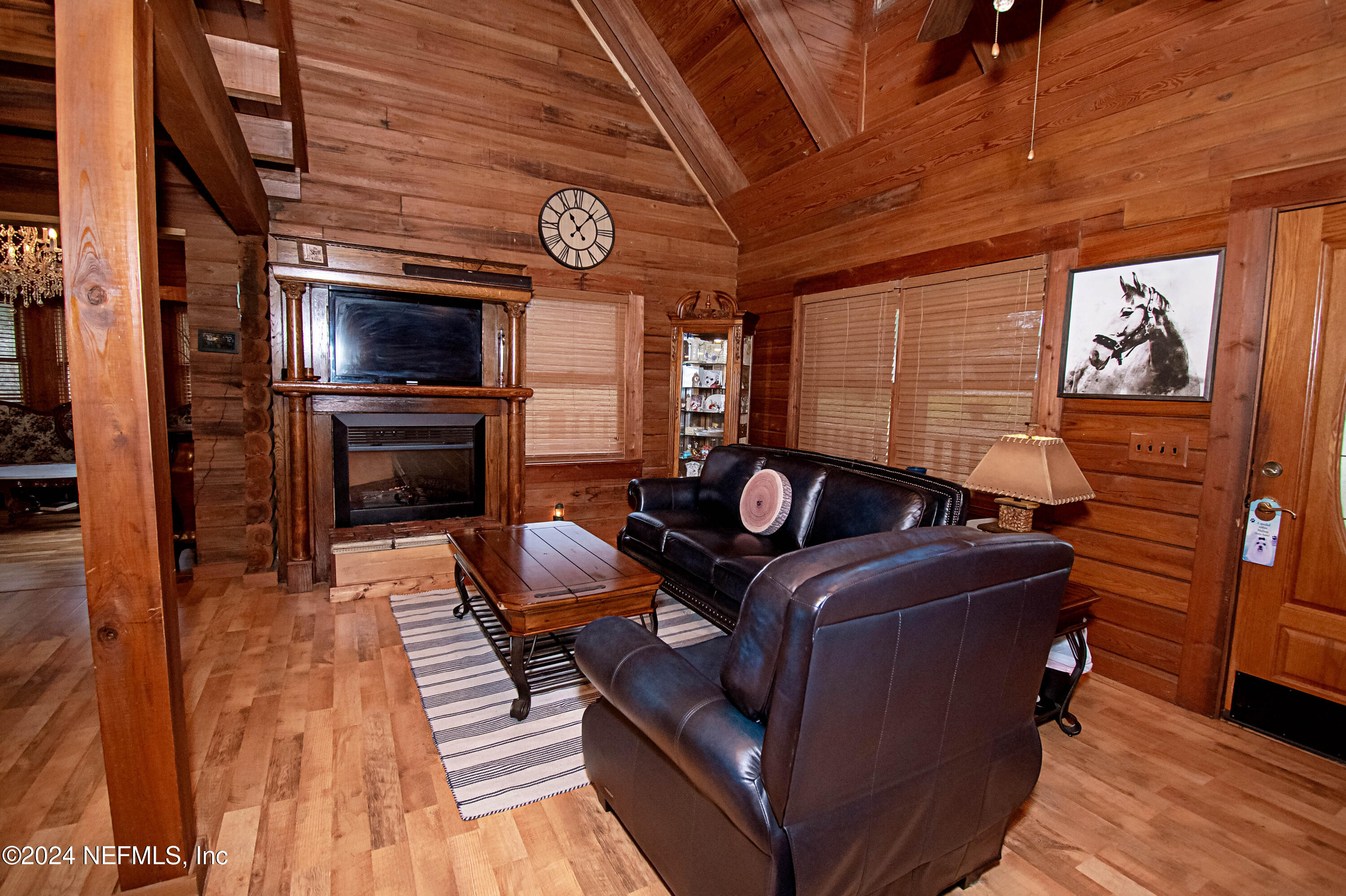 149 Rhoden Drive Macclenny, FL 32063 - Photo 17 of 63 a view of a livingroom with furniture and a flat screen tv