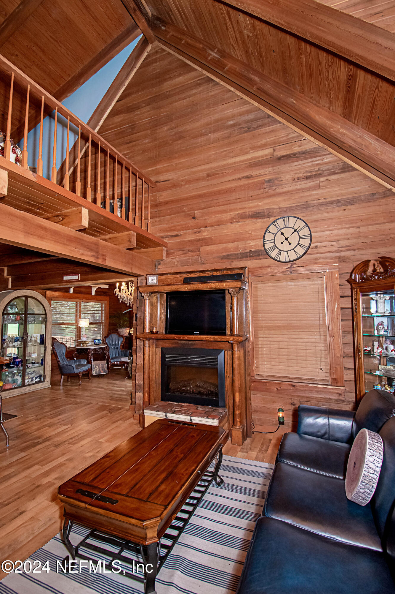 149 Rhoden Drive Macclenny, FL 32063 - Photo 19 of 63 a living room with furniture a flat screen tv and couches