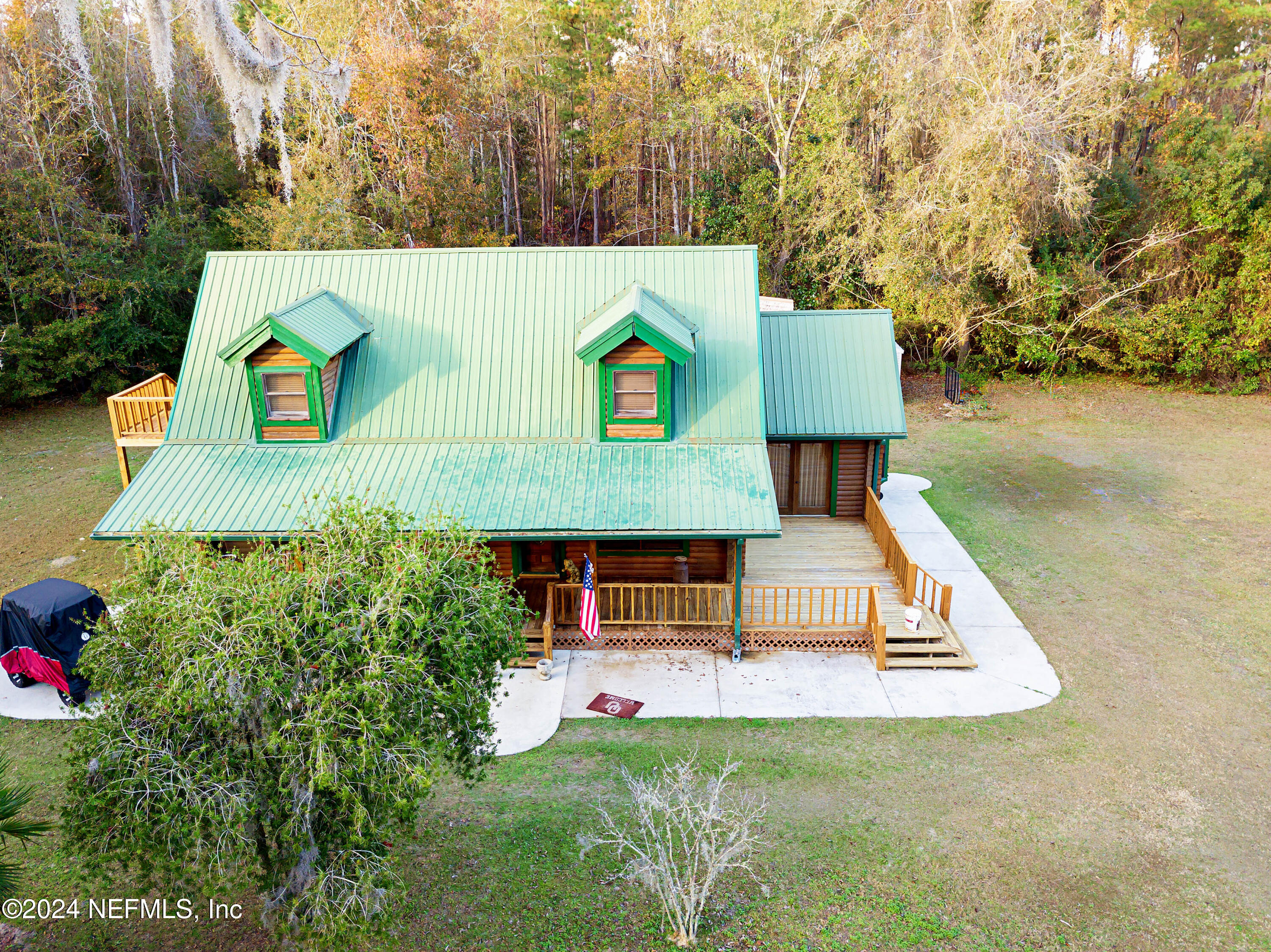 149 Rhoden Drive Macclenny, FL 32063 - Photo 2 of 63 a aerial view of a house with swimming pool and sitting area