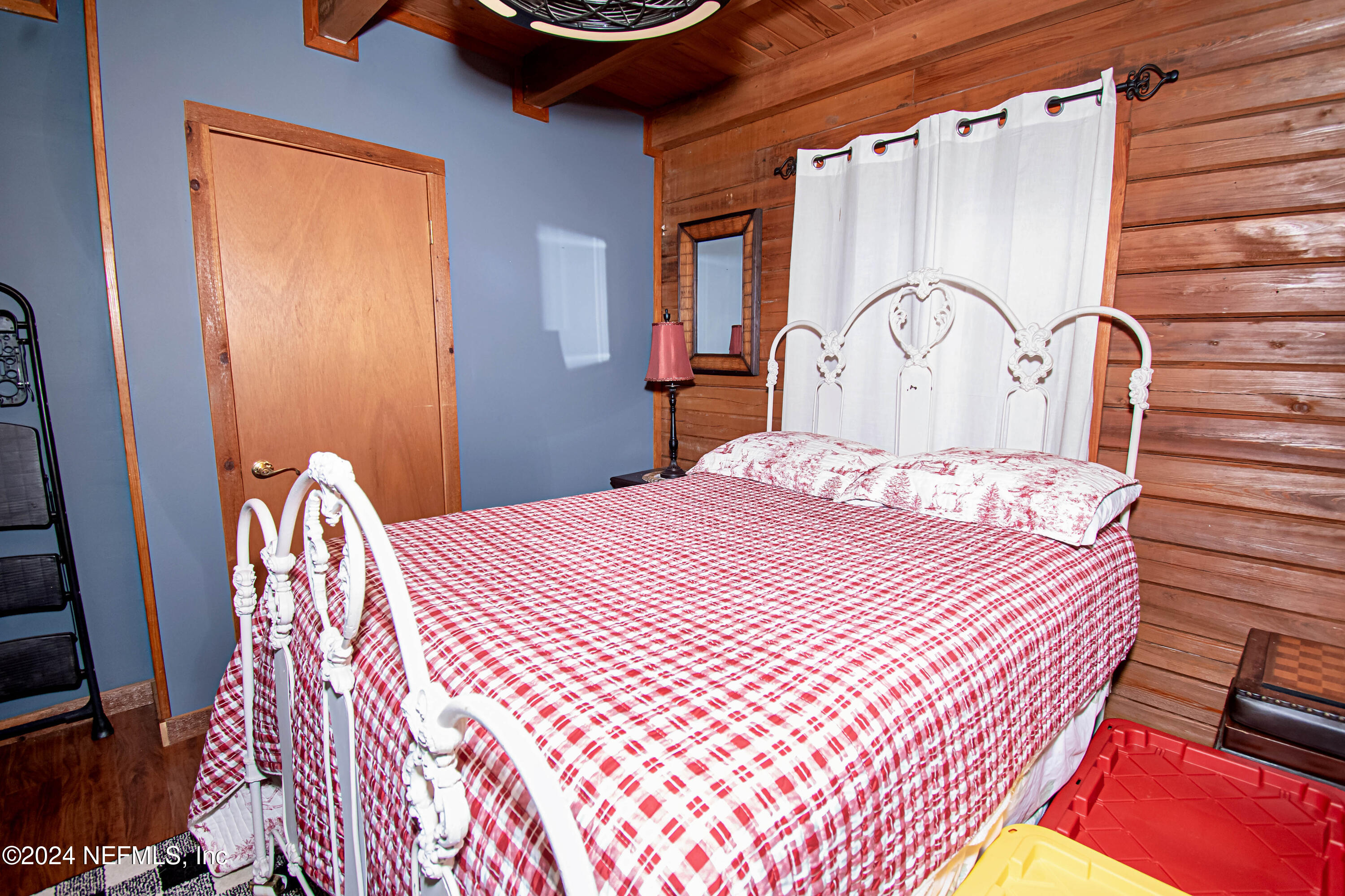 149 Rhoden Drive Macclenny, FL 32063 - Photo 27 of 63 a bedroom with a bed next to a window with outer view