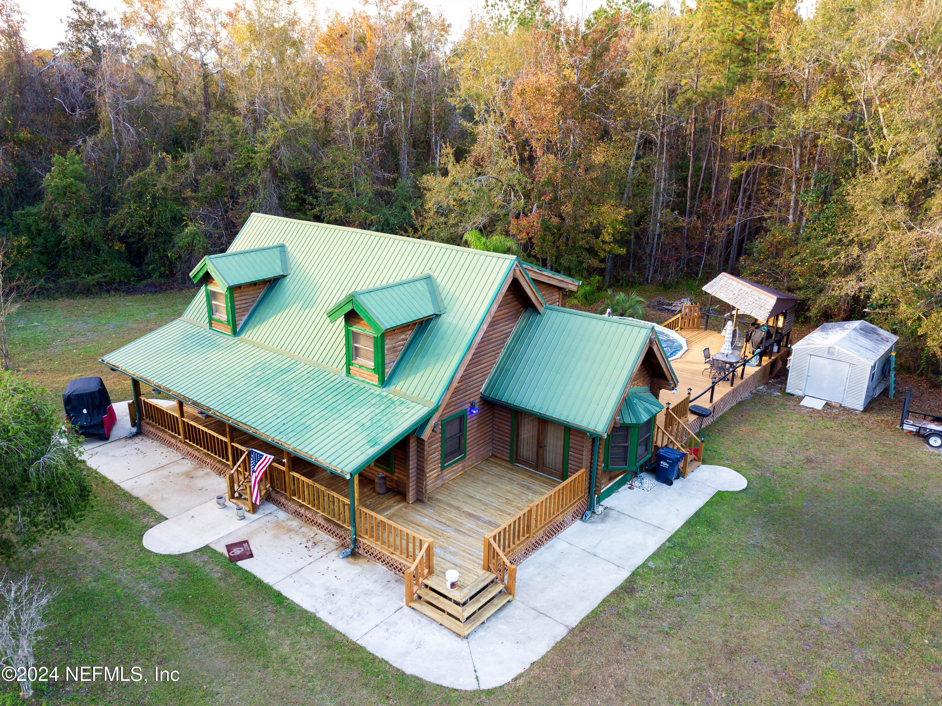 149 Rhoden Drive Macclenny, FL 32063 - Photo 4 of 63 an aerial view of a backyard with a patio
