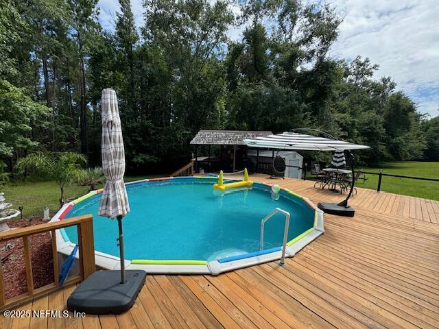 149 Rhoden Drive Macclenny, FL 32063 - Photo 43 of 63 a view of a swimming pool with a patio