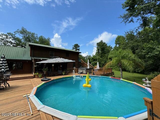 149 Rhoden Drive Macclenny, FL 32063 - Photo 45 of 63 swimming pool view with a outdoor seating