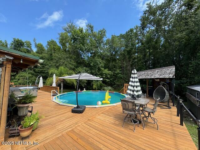 149 Rhoden Drive Macclenny, FL 32063 - Photo 46 of 63 a view of a swimming pool with a patio