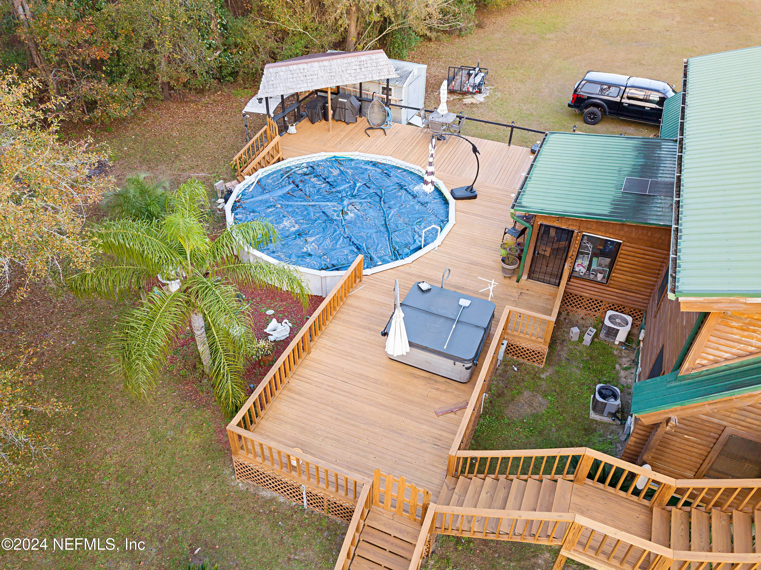 149 Rhoden Drive Macclenny, FL 32063 - Photo 60 of 63 an aerial view of a house with swimming pool and outdoor space
