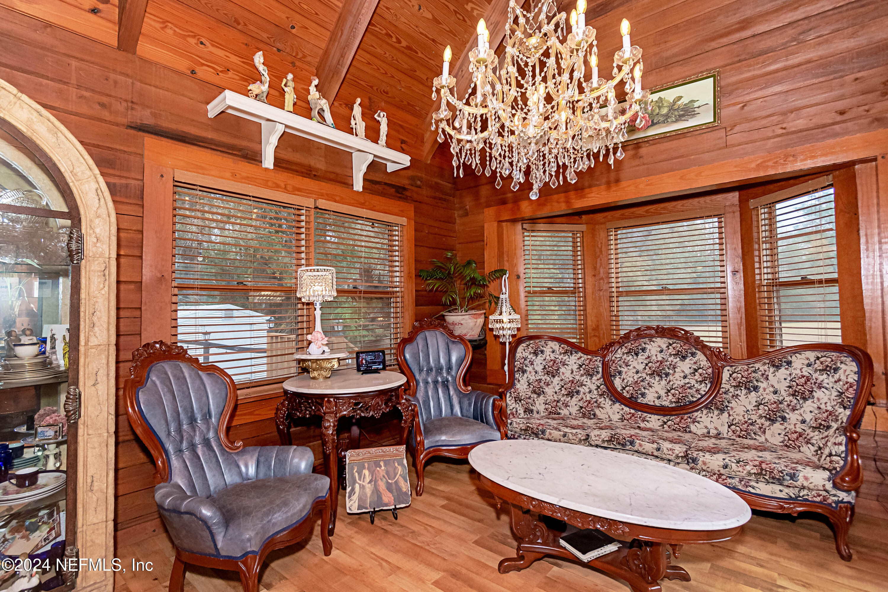 149 Rhoden Drive Macclenny, FL 32063 - Photo 6 of 63 a dining room with furniture wooden floor and a chandelier