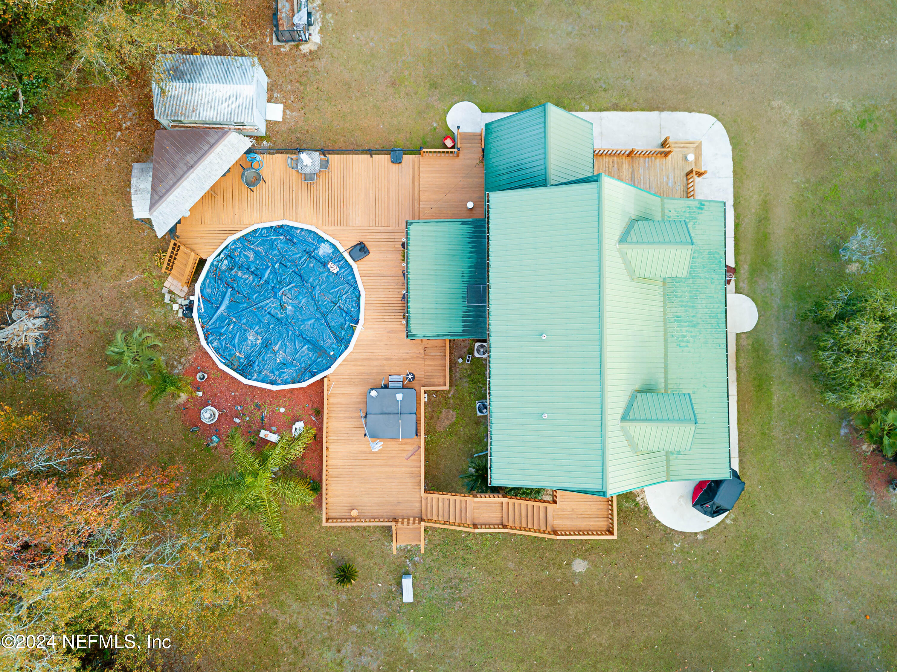 149 Rhoden Drive Macclenny, FL 32063 - Photo 62 of 63 an aerial view of a house with swimming pool and outdoor space