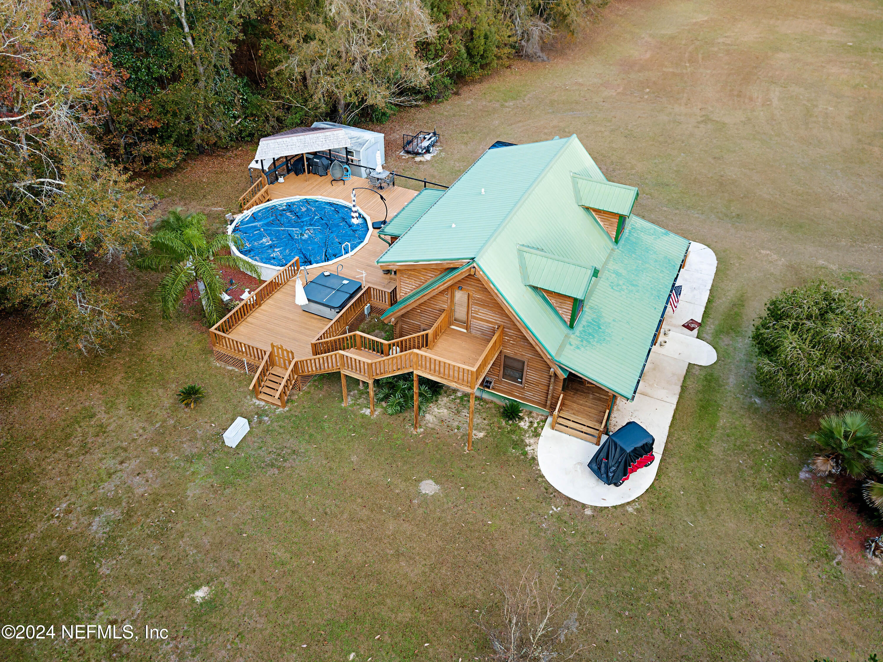 149 Rhoden Drive Macclenny, FL 32063 - Photo 63 of 63 an aerial view of a house with swimming pool and outdoor space