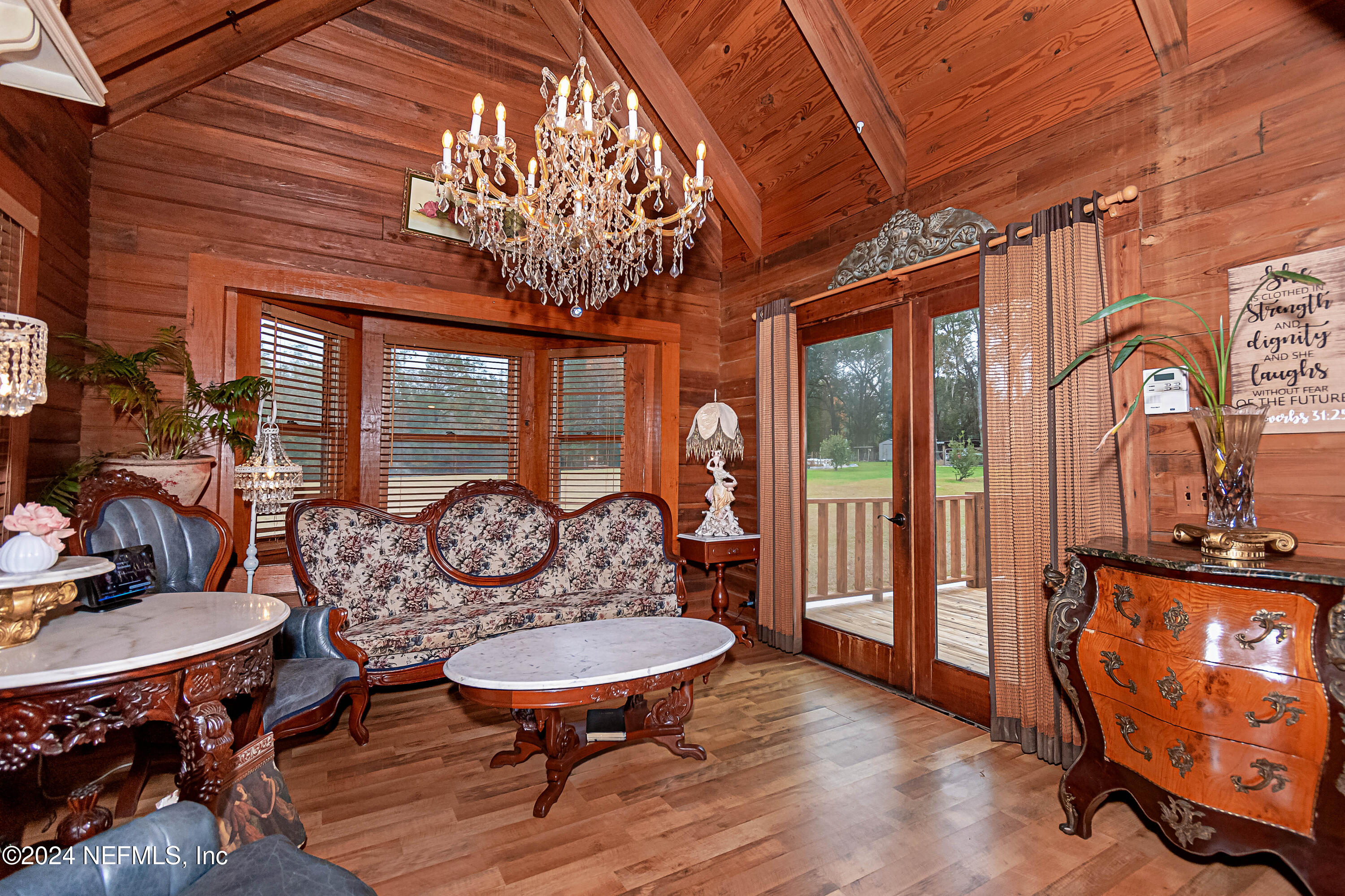 149 Rhoden Drive Macclenny, FL 32063 - Photo 7 of 63 a view of a livingroom with furniture window and wooden floor