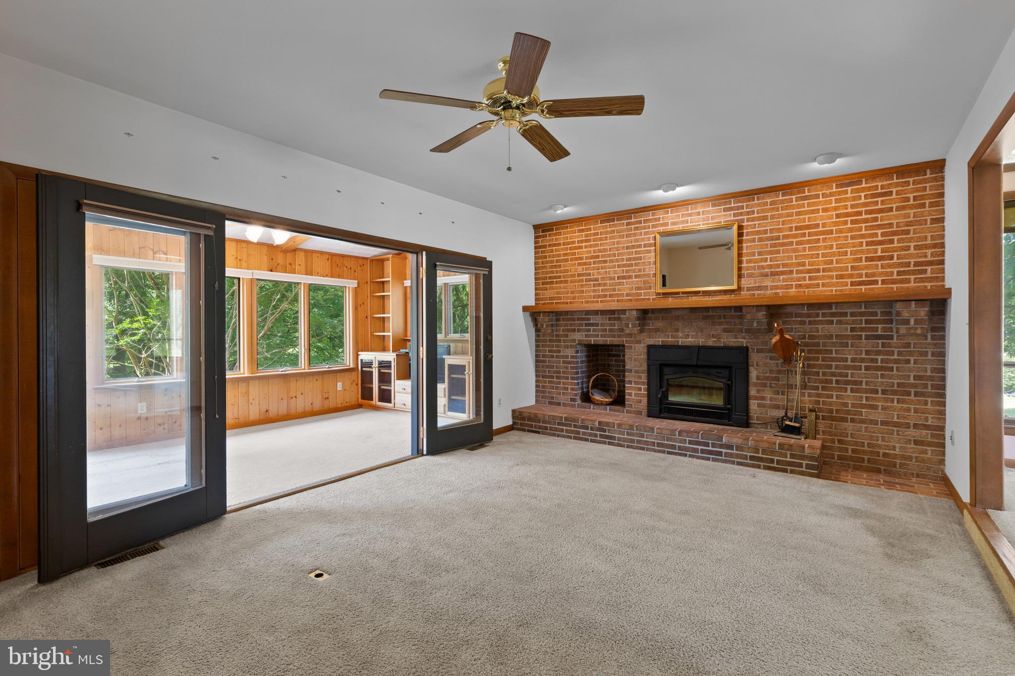 7517 Brooklyn Bridge Road Laurel, MD 20707 - Photo 13 of 41 Fireplace off kitchen For cozy evenings