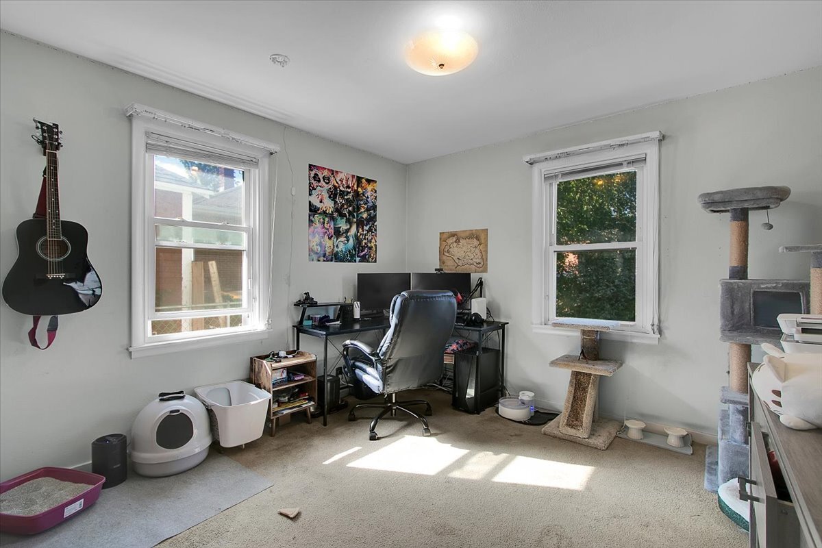 703 Oakland Avenue Joliet, IL 60435 - Photo 8 of 13 a view of a livingroom with workspace and a window