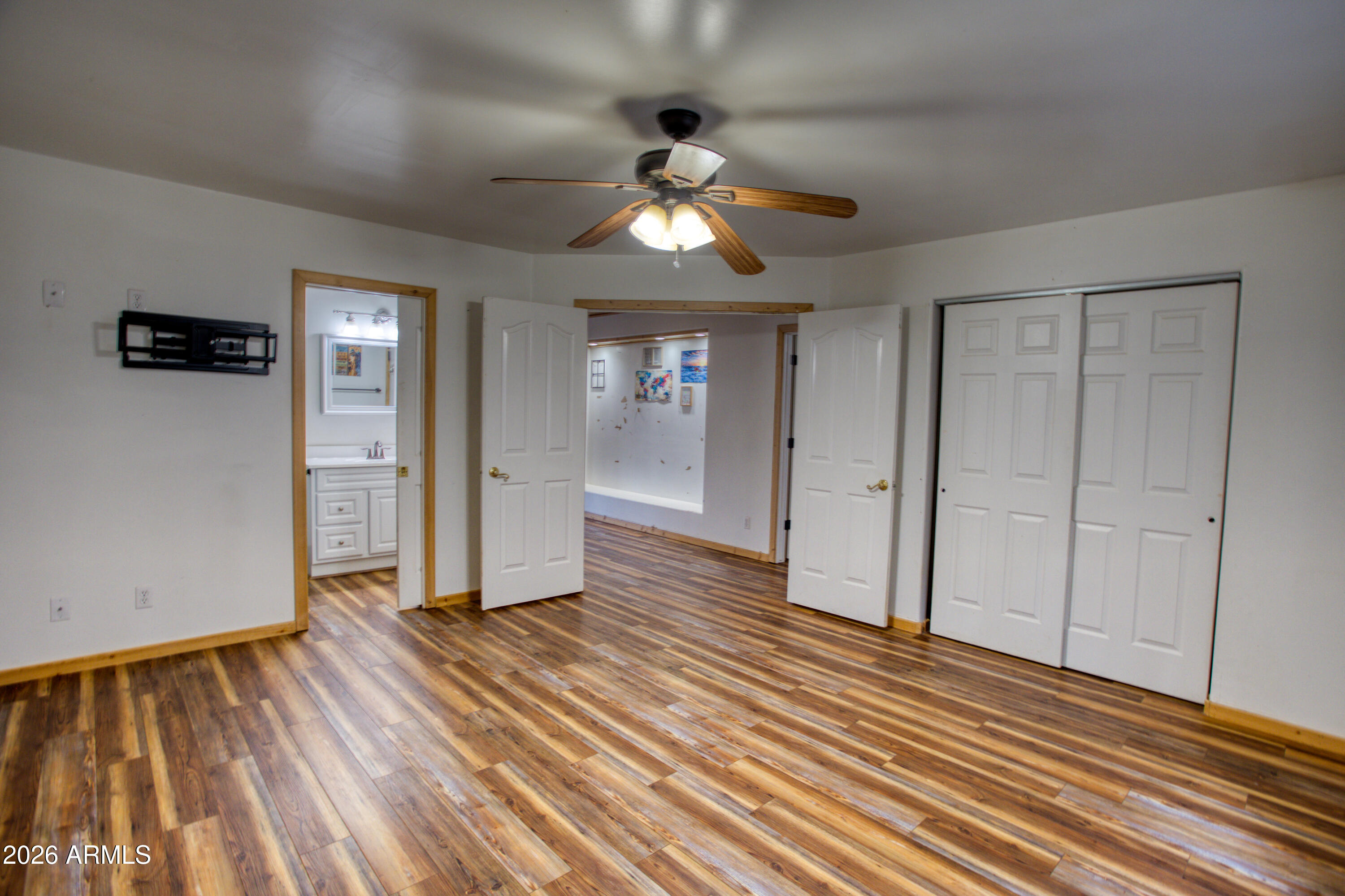 1420 Meadow View Place Show Low, AZ 85901 - Photo 20 of 25 a view of empty room with wooden floor